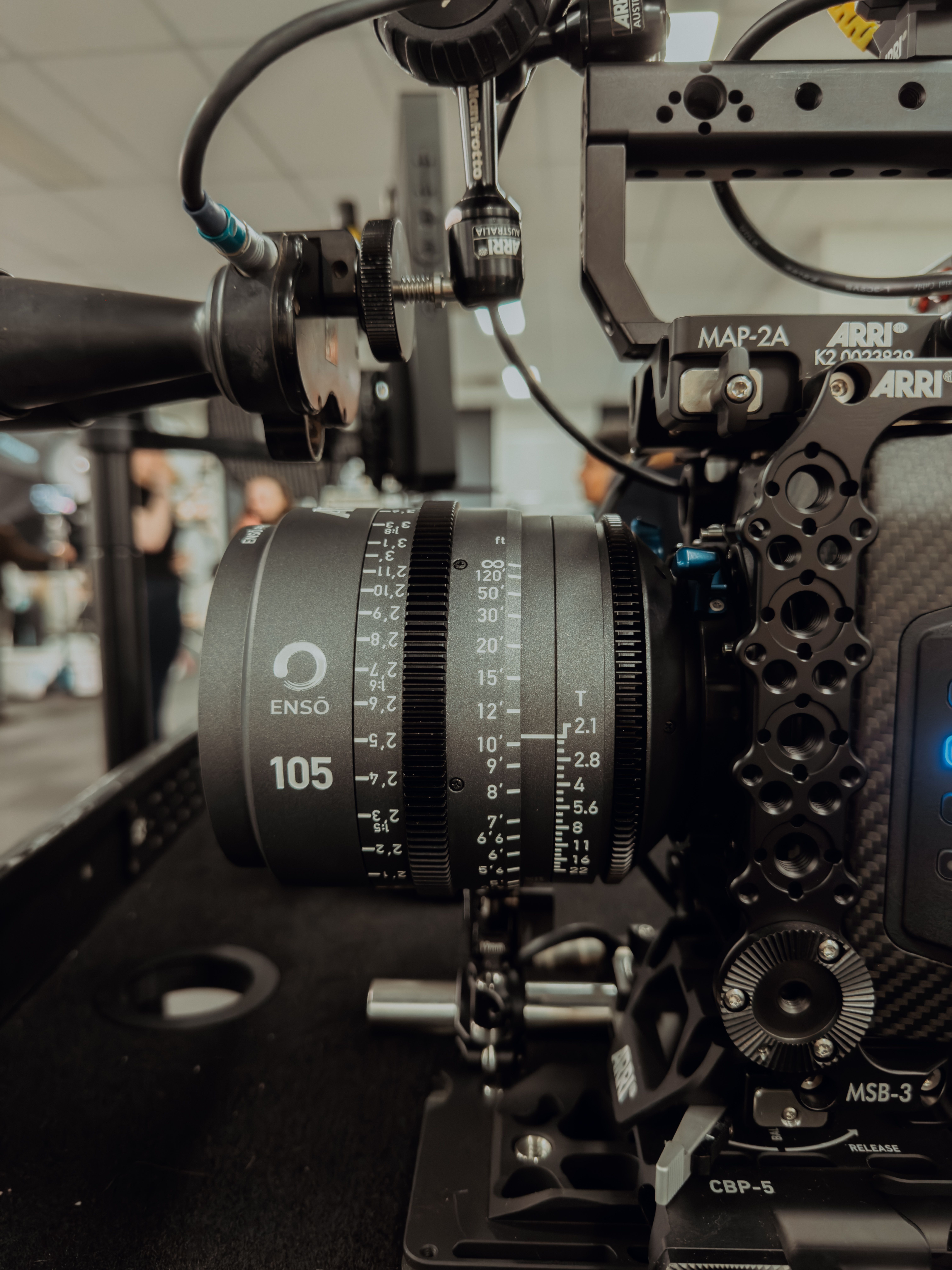 Detailed shot of a professional film camera in an indoor studio setting.