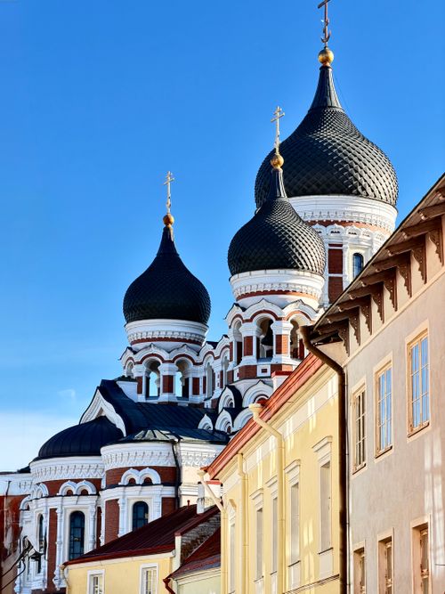 Free A captivating view of the Alexander Nevsky Cathedral domes against a blue sky in Tallinn, Estonia. Stock Photo