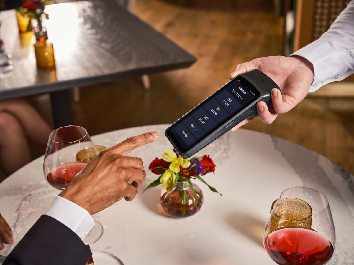 Elegant fine dining setting with a digital point of sale system for seamless payment and tipping
