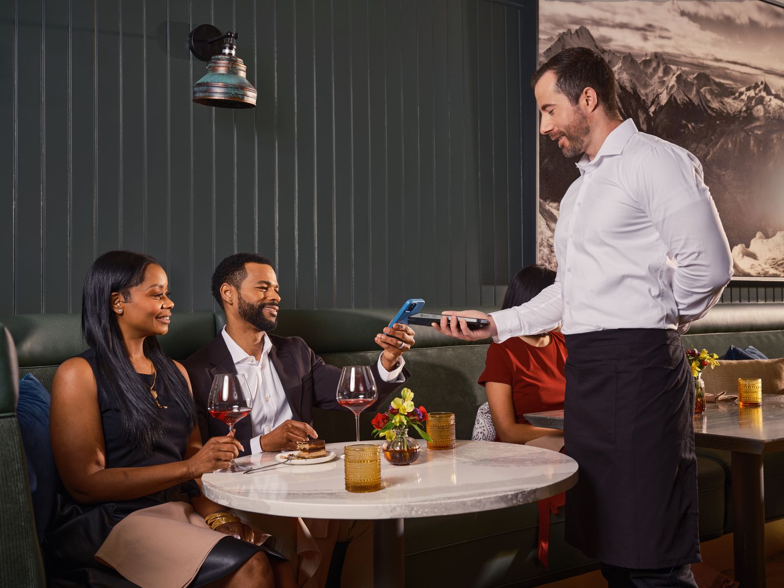 Restaurant staff member entering an order into a point of sale