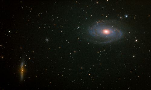Free A captivating view of a spiral galaxy surrounded by thousands of stars in the night sky. Stock Photo