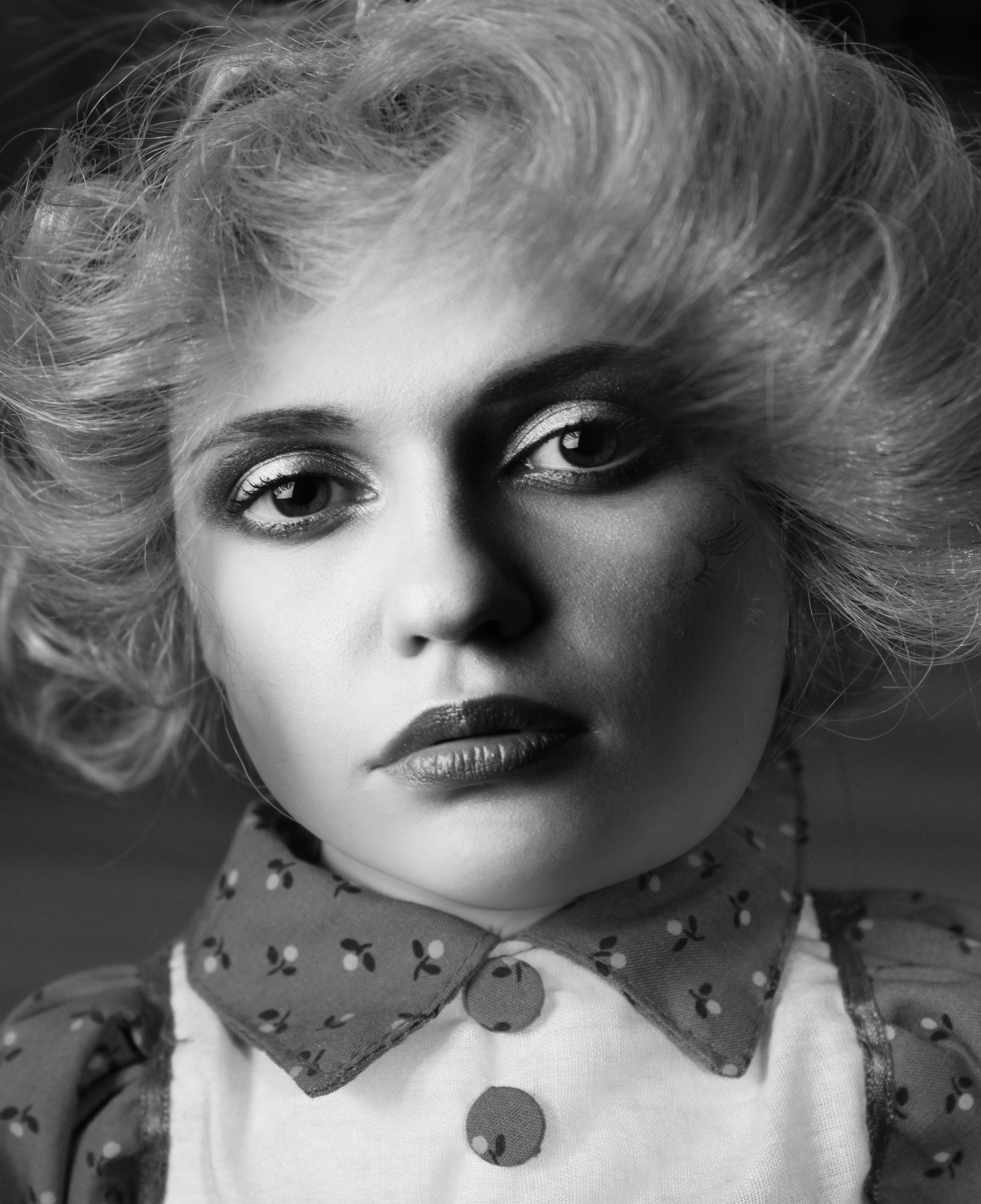 Grayscale Photo of Woman in Collared Shirt in Close Up 