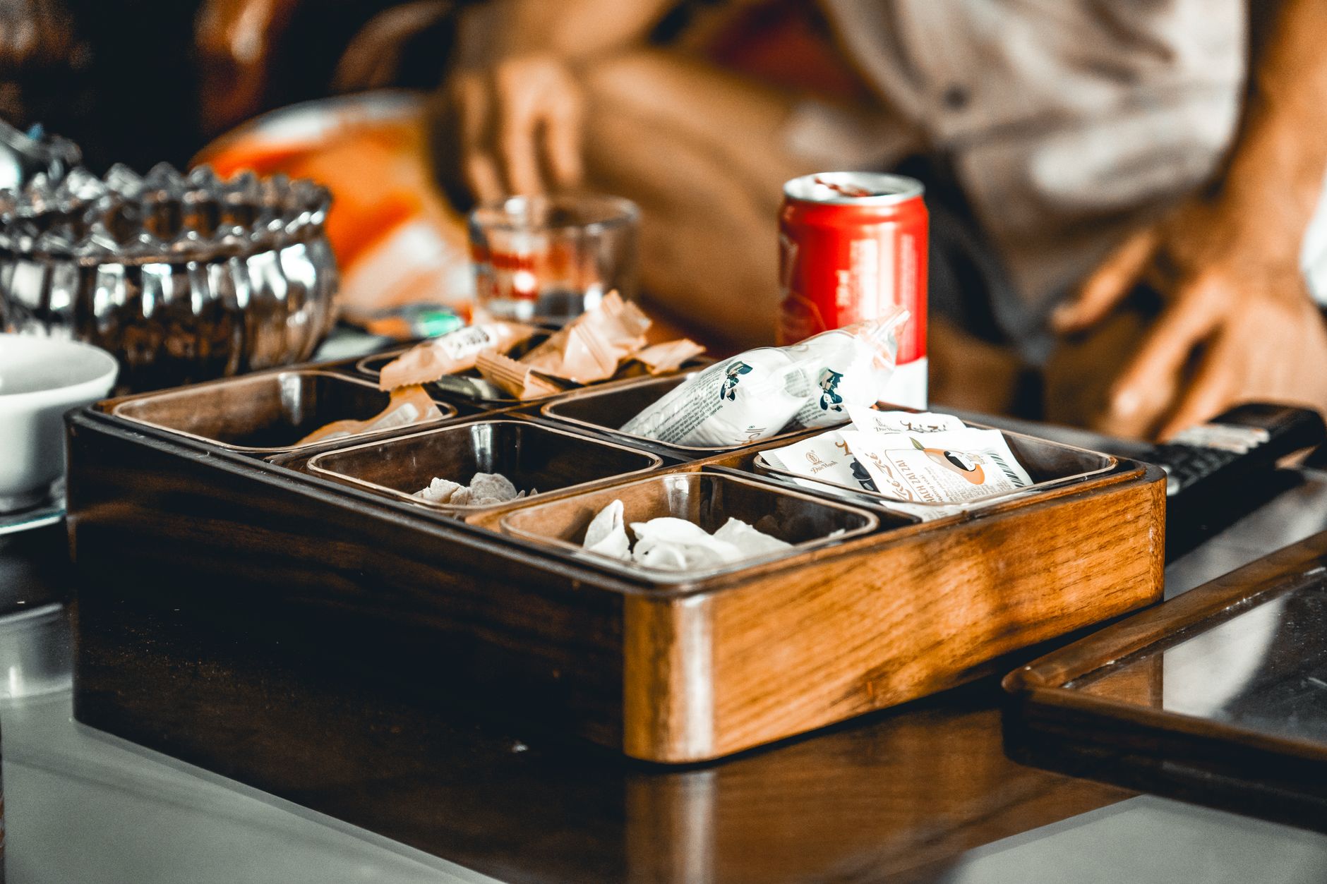 A relaxed coffee table setting with snacks, beverages, and casual ambiance at home.