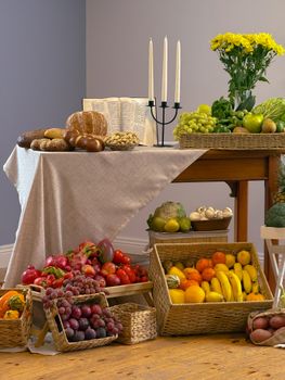 Colorful assortment of fruits, bread, and flowers arranged on a linen-covered table in Тёрлс, Ireland.