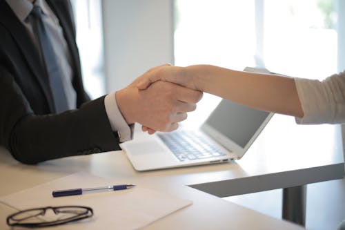 Free Person in Black Suit Hired An Employee Stock Photo