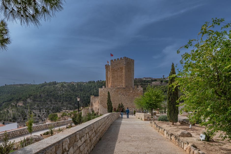 Explore the scenic beauty of Alcalá del Júcar with its historic castle and lush surroundings.