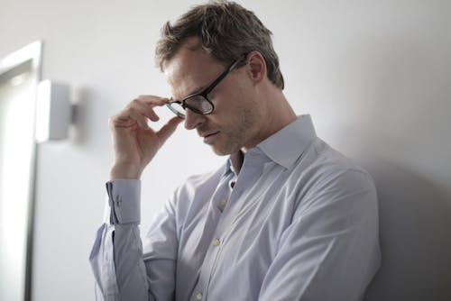 Photo Of Man Wearing Black Eyeglasses