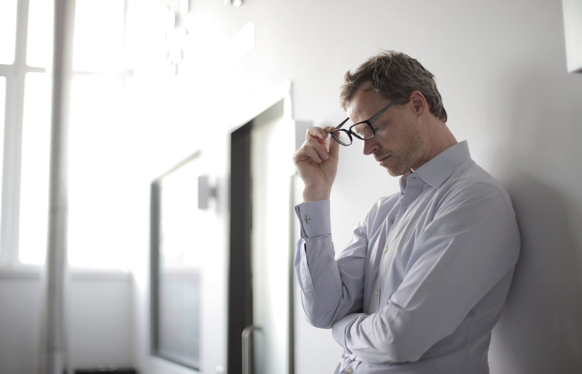 Free Photo Of Man Holding Black Eyeglasses Stock Photo