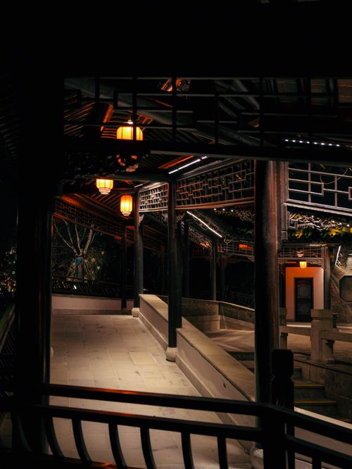 Free Illuminated traditional Asian structure with warm lighting at night. Stock Photo