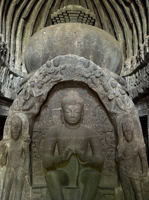 Free Intricate stone carvings of Buddha inside Indian cave temple, showcasing ancient art. Stock Photo