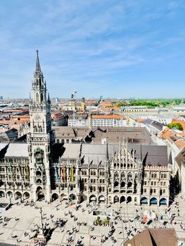 Stunning aerial shot of Marienplatz with Munich's iconic New Town Hall on a sunny day.