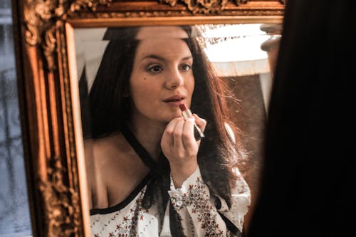 Woman Applying Make-Up