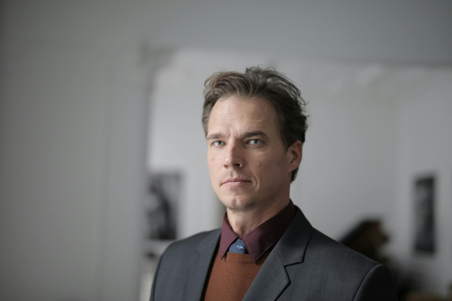 Selective Focus Portrait Photo of Man in Formal Wear