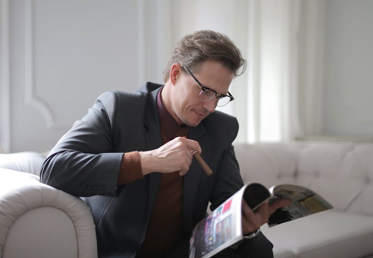 Man Reading A Magazine