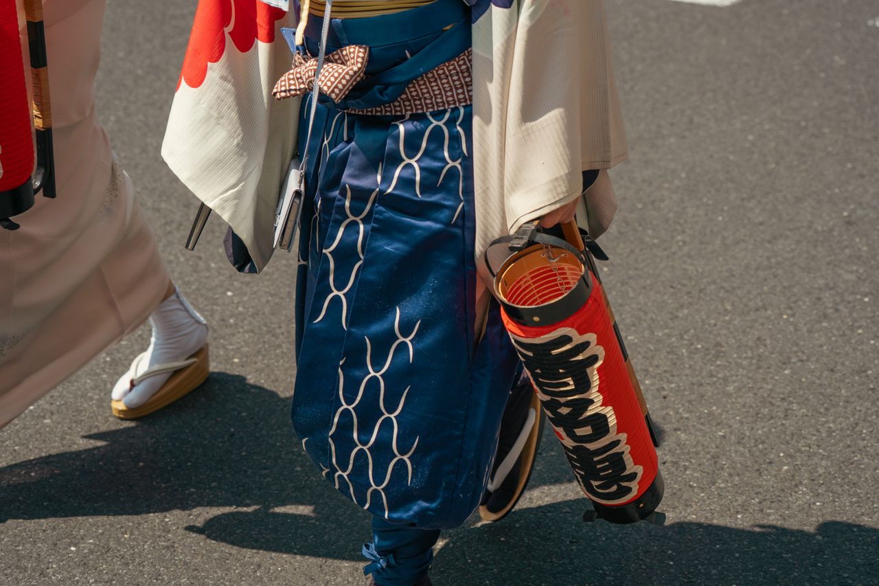 a close up view of traditional japanese festival attire and lantern in