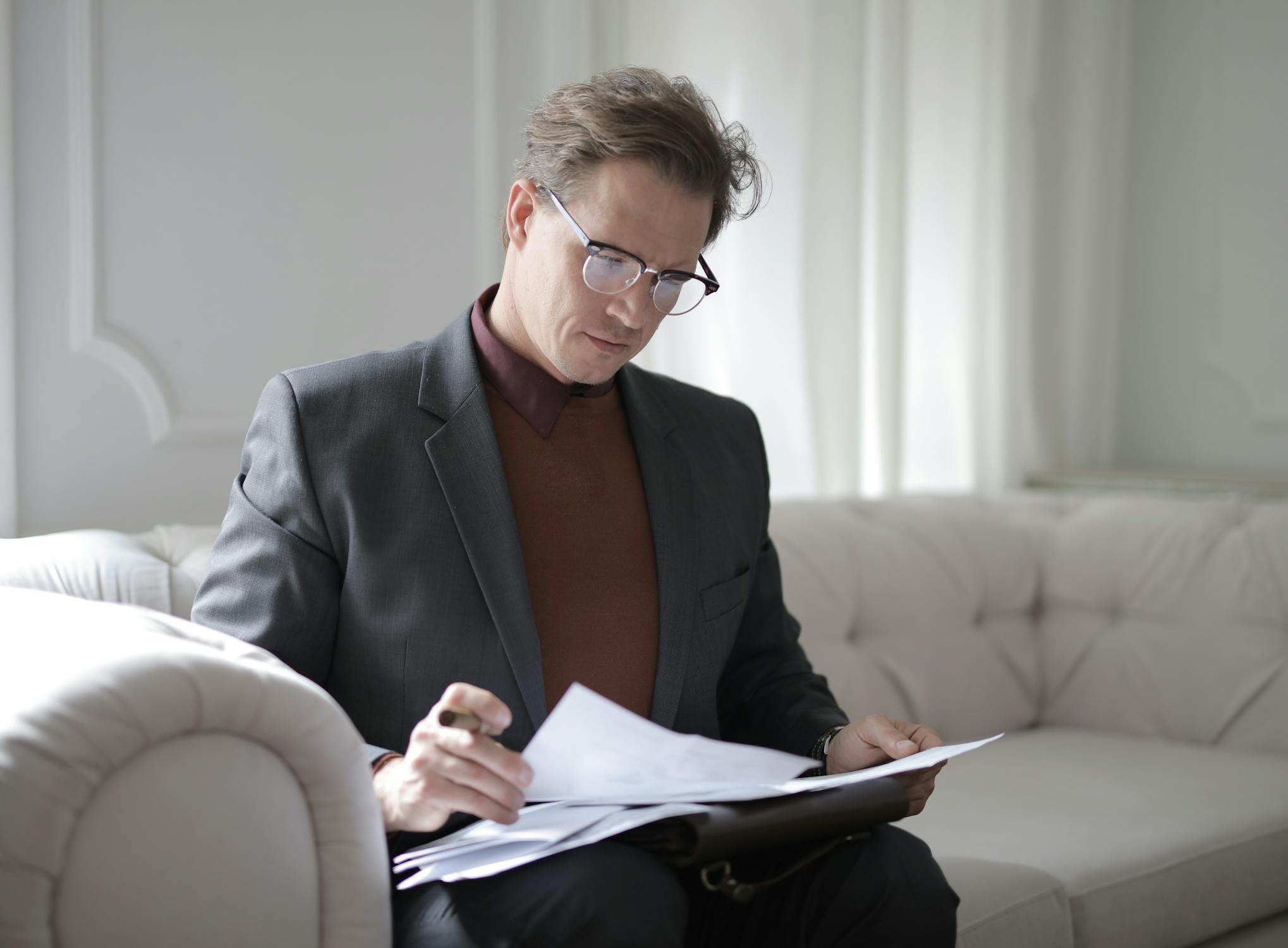 A diligent personal injury lawyer carefully reviewing legal documents in a focused manner