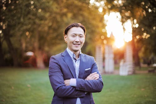 Man in Blue Suit Jacket Smiling