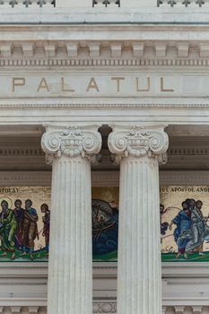 Detailed view of the ornate columns and mosaic in a historic building in Bucharest, Romania.