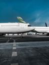 Airplanes on runway of modern aerodrome on sunny day