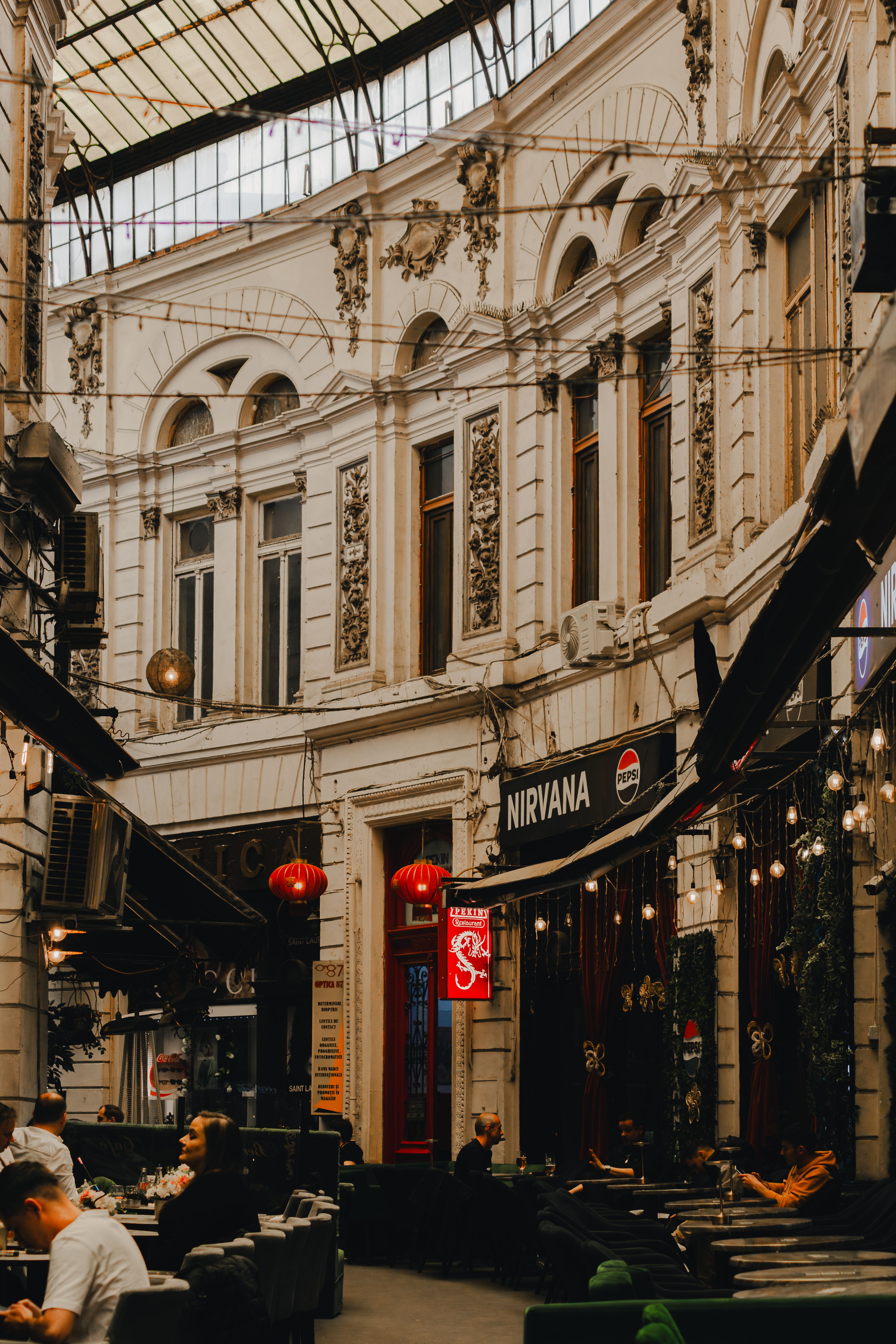 Explore the historic architecture of a passage in Bucharest, Romania. A blend of classic and modern vibes.