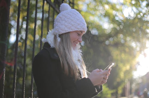Free Photo of Woman Using Mobile Phone Stock Photo
