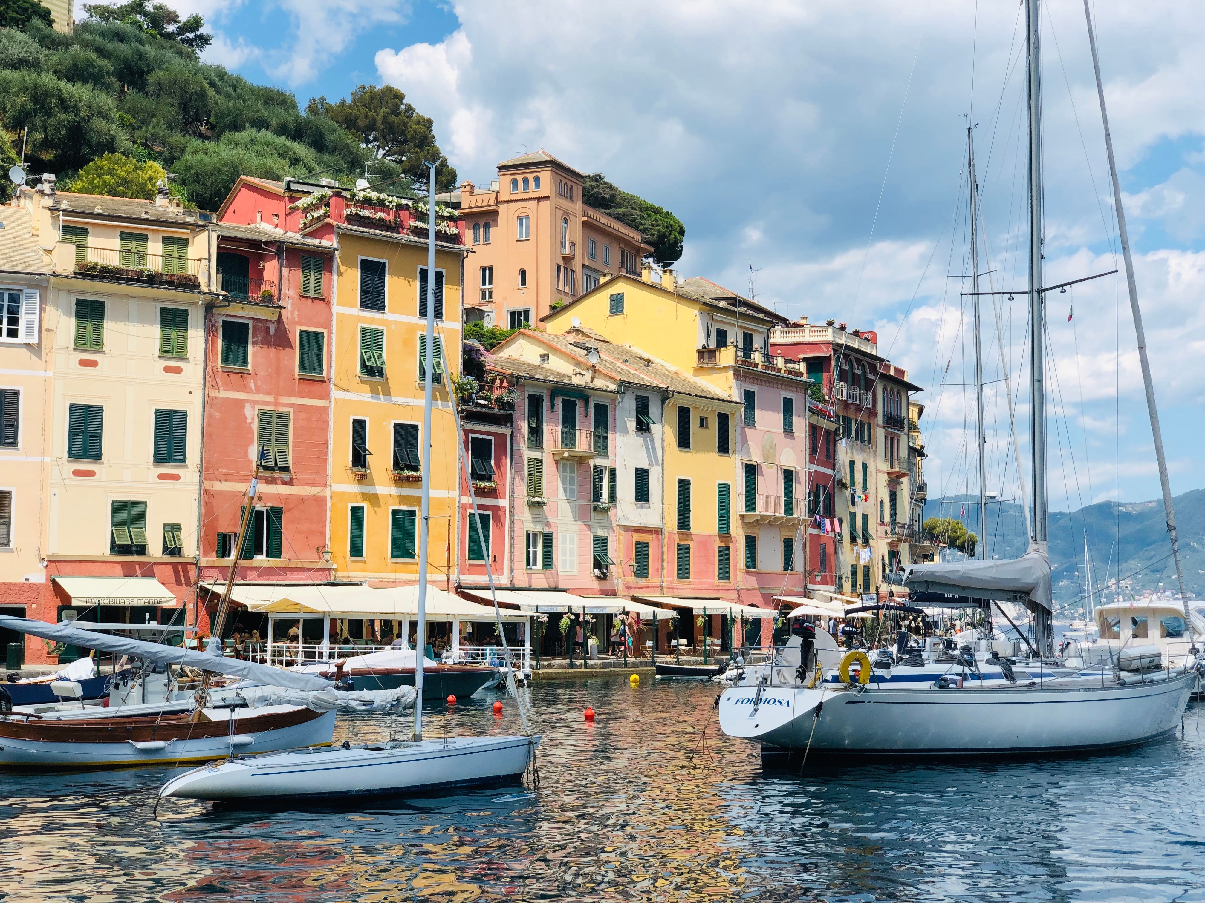 Unforgettable Yacht Tour in the Gulf of Cagliari with Aperitif Review: A Sardinian Sailing Experience Worth Every Euro Review 2026 - Explore the vibrant architecture of Portofino, Italy, with colorful buildings and serene yachts by the harbor.