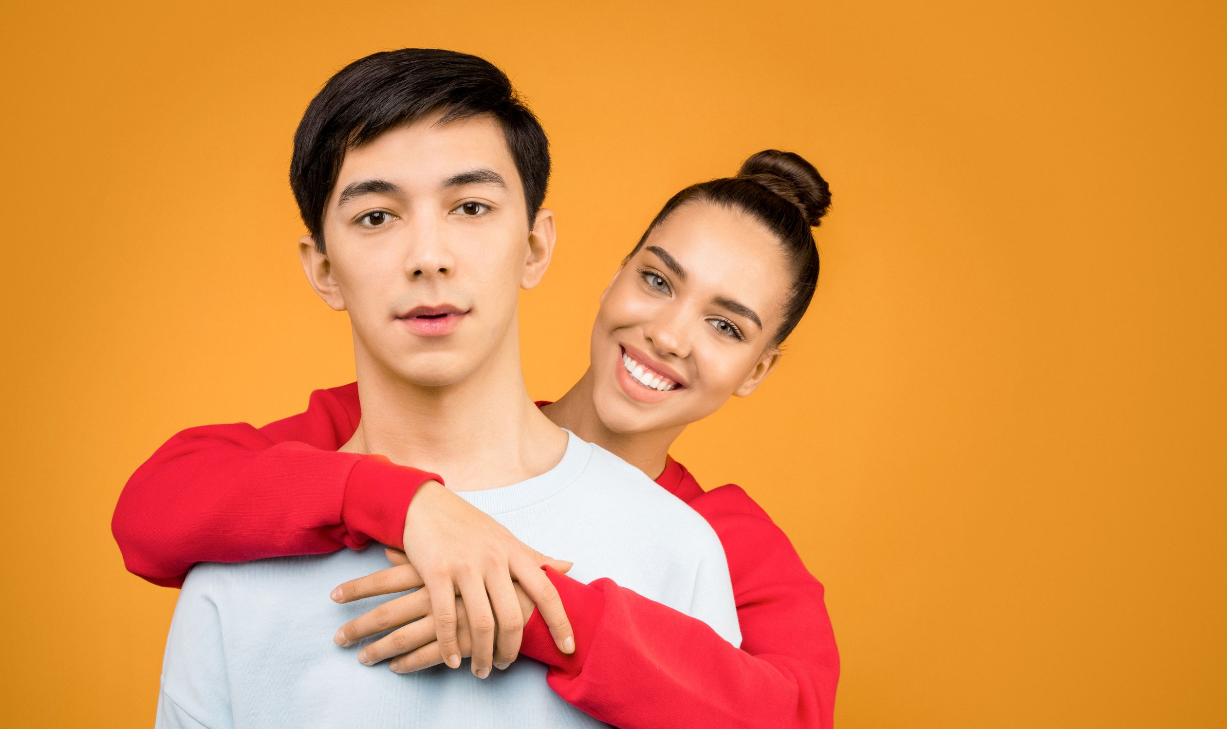 Photo of Smiling Woman Hugging Man from Behind · Free Stock Photo