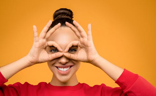 Photo of Woman Doing Hand Gesture