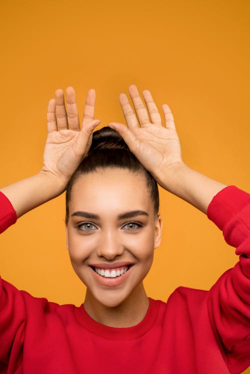 Photo of Woman Raising Her Hands