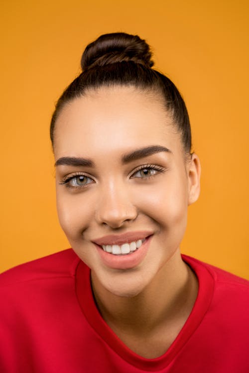 Smiling in Woman in Red Crew Neck Sweatshirt