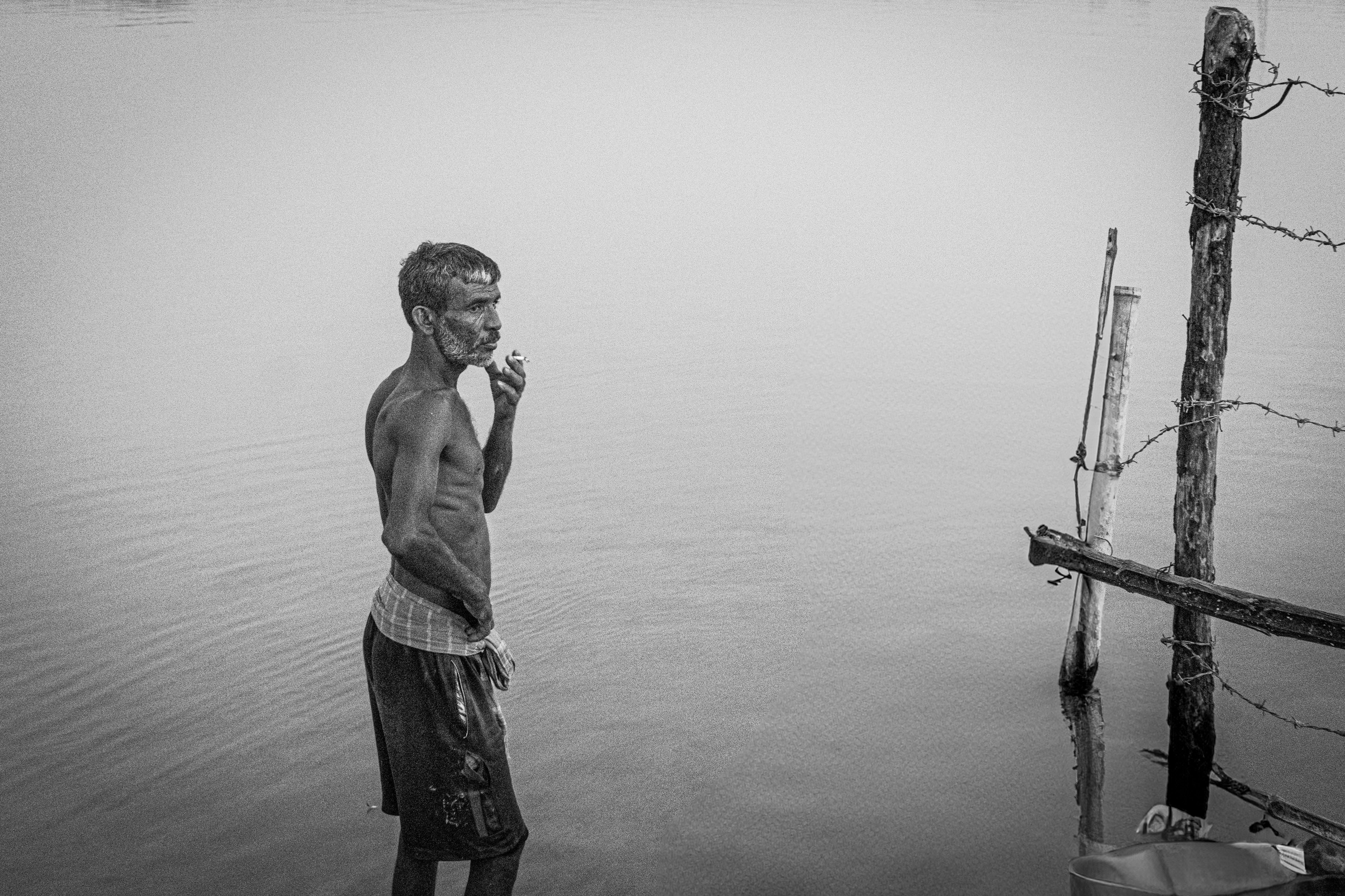 Contemplative Man by Tranquil Waterside · Free Stock Photo