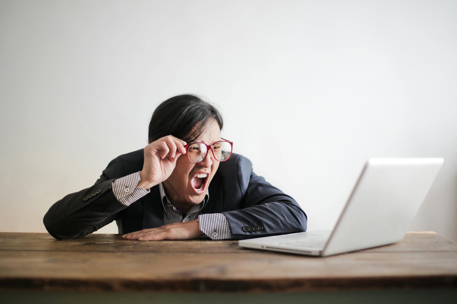 Man using glasses to look at computer