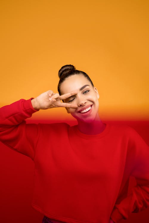 Photo of Woman in Red Sweater