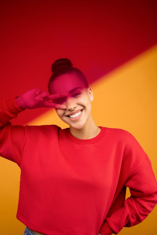 Free Smiling Woman in Red Crew Neck Long Sleeve Shirt Stock Photo