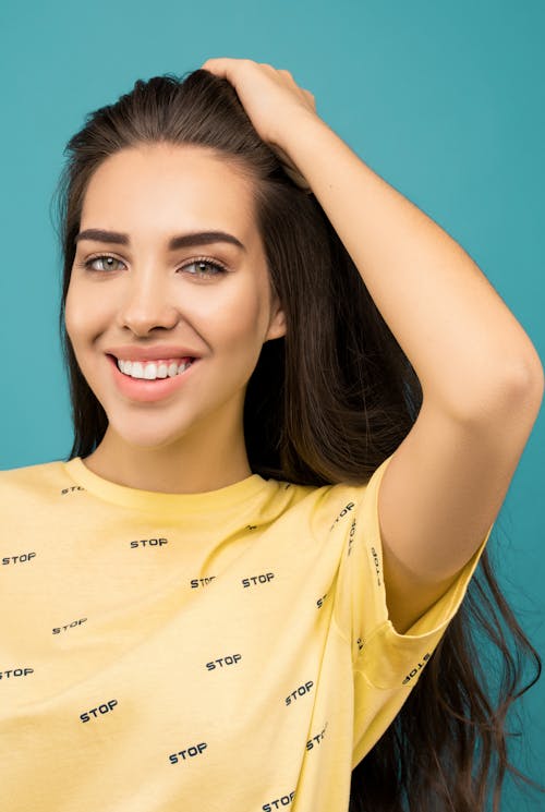 Photo of Woman In Yellow Shirt