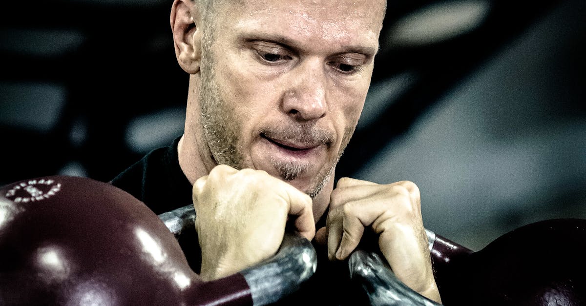 Man Holding Kettle Bells · Free Stock Photo