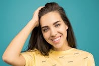 Photo of Woman Wearing Yellow Shirt