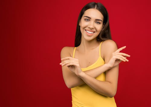 Photo of Woman In Yellow Tank Top