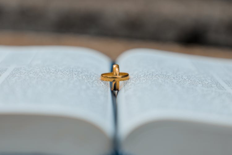 Golden Rings On Book During Wedding Day