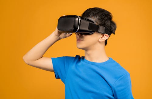 Free Man Putting on a VR Headset Stock Photo