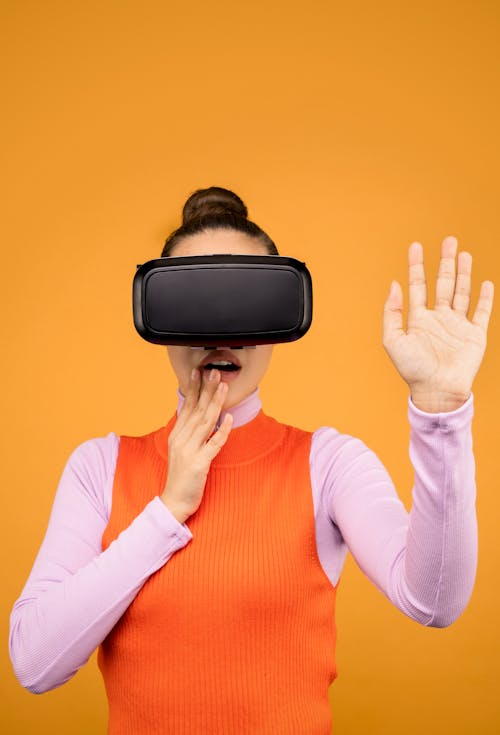 Woman in Long Sleeve Shirt Surprised in Virtual Reality