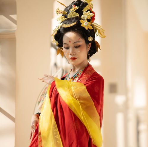 Free Portrait of a woman in vibrant traditional Asian attire indoors, showcasing cultural elegance. Stock Photo