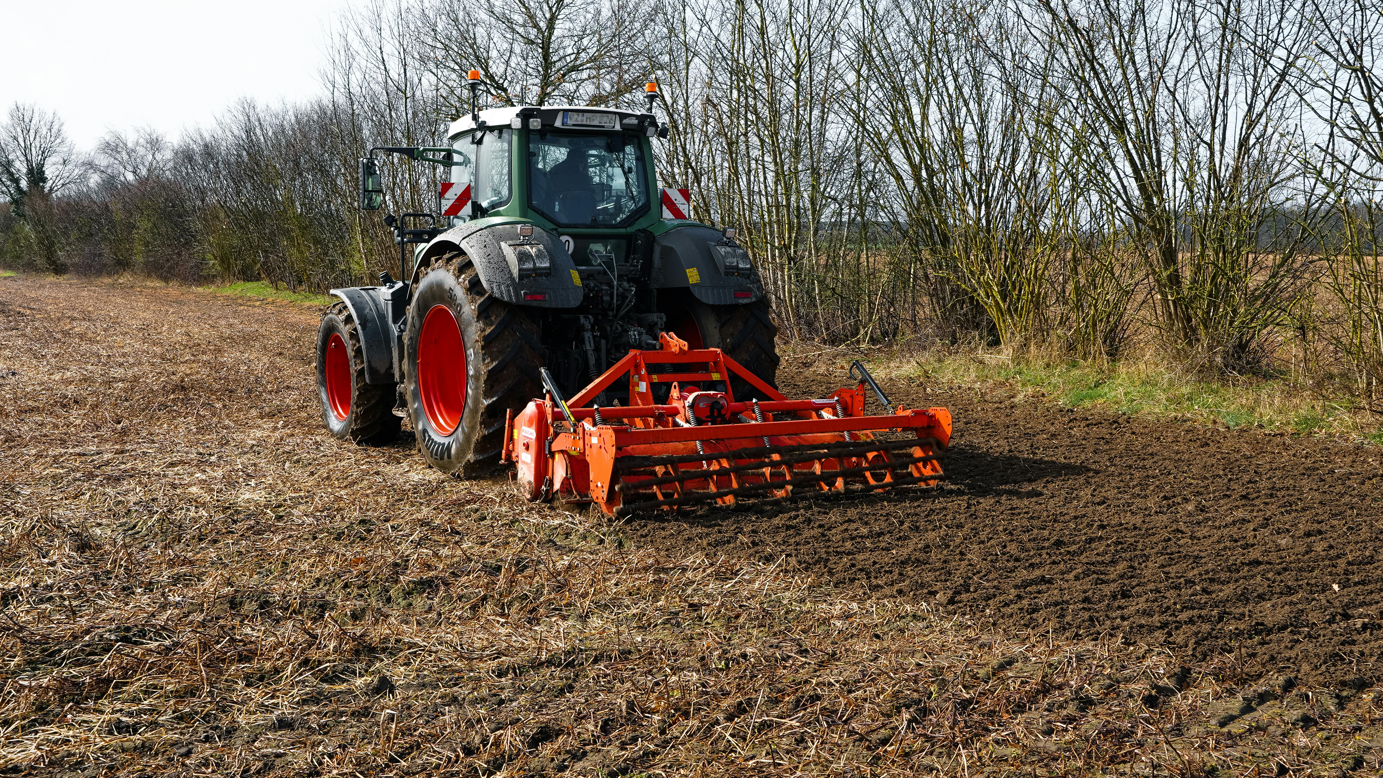 A tractor plowing a field in Wiershop, Germany, preparing for spring planting.