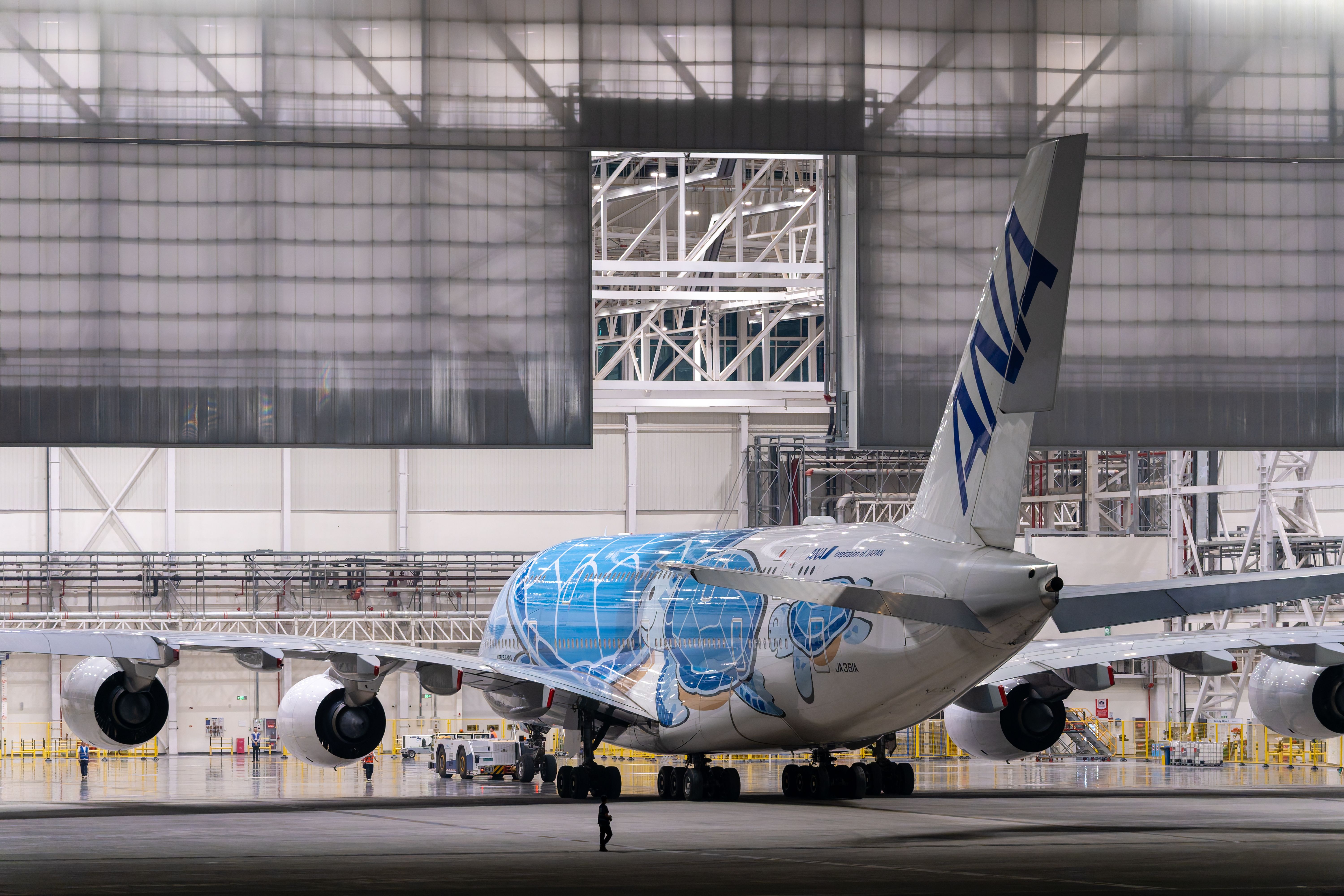 Close-up of an aircraft engine and propeller in a hangar