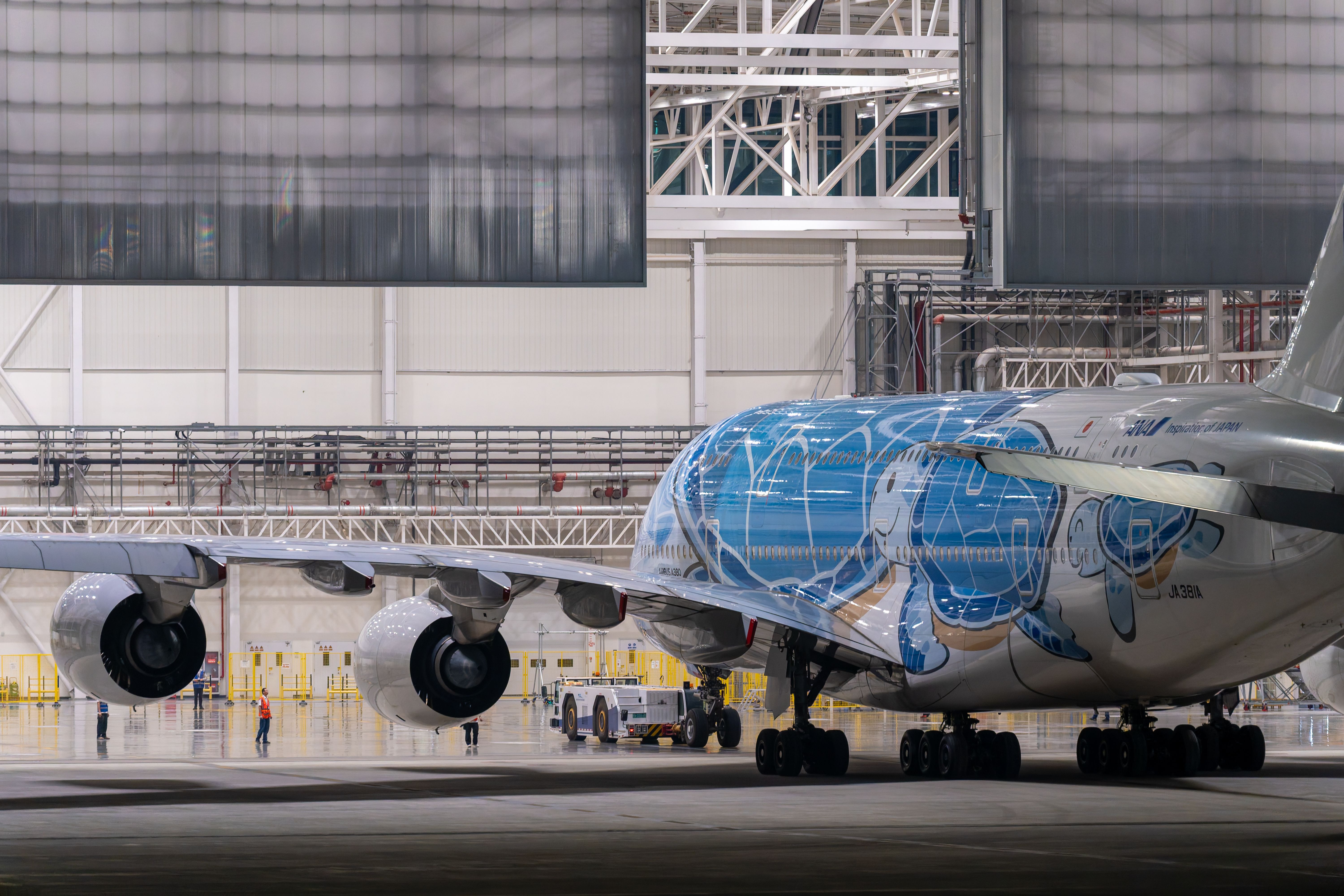aircraft maintenance hangar technician working on engine
