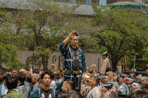 Free Participants in traditional attire march in a lively Japanese festival in Tokyo, Japan. Stock Photo