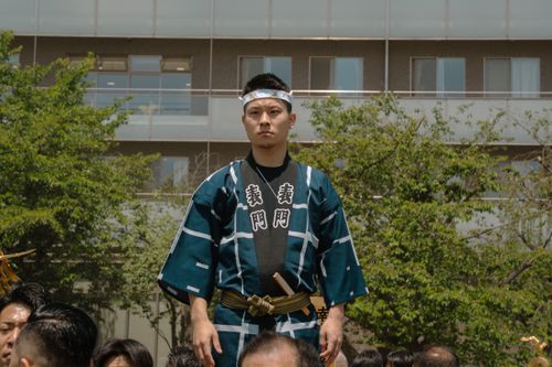 Free Man in traditional attire during a festival in Tokyo, Japan. Outdoor cultural celebration with vibrant colors. Stock Photo