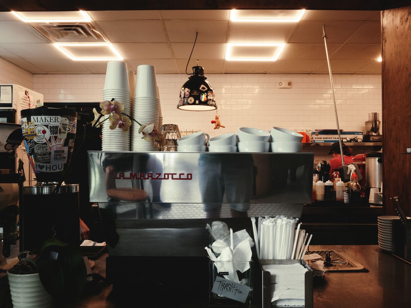 Warm, inviting coffee shop interior with an espresso machine