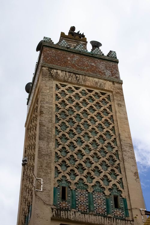Free Intricate architecture of a historic minaret tower in Fes, Morocco, showcasing traditional Moroccan design. Stock Photo