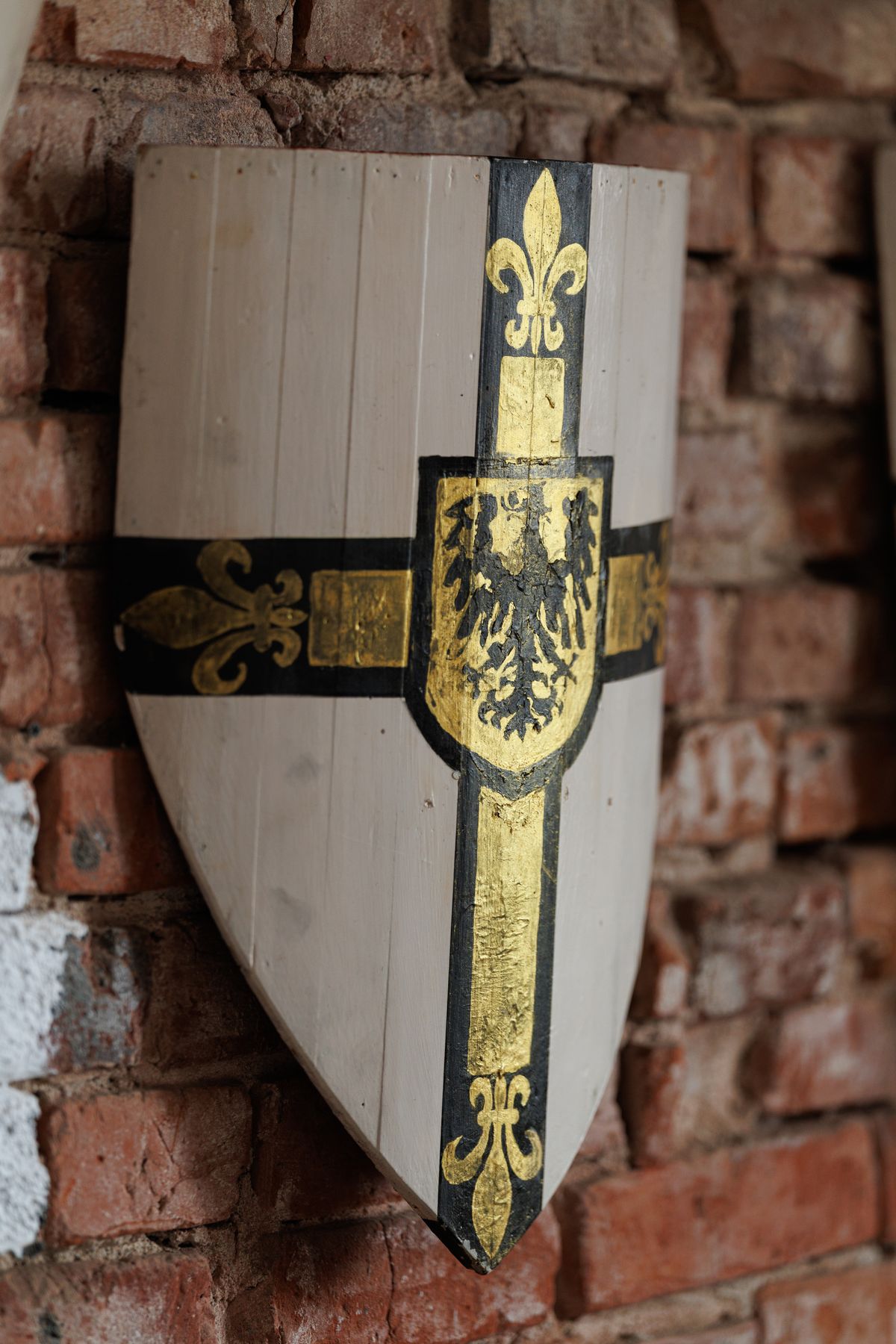 Medieval Helmet and Shield Display on Wall · Free Stock Photo